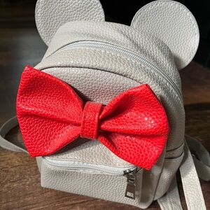 Disney theme mini backpack. Side pockets and adjustable straps.
